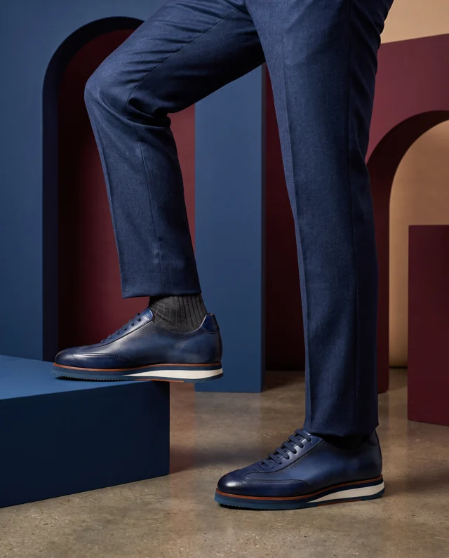 Navy lace-up with textured panels and a white contrast sole